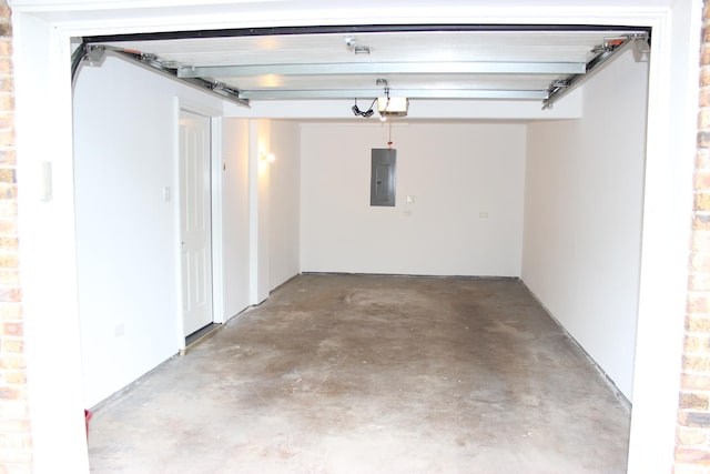 garage with electric panel and a garage door opener