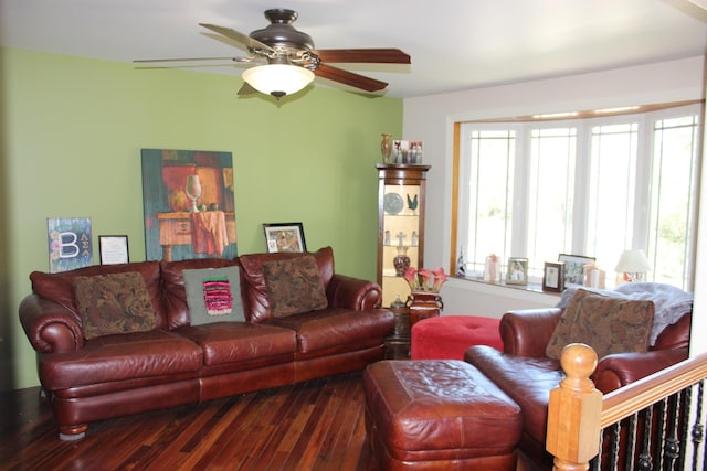 living room featuring hardwood / wood-style flooring and a ceiling fan