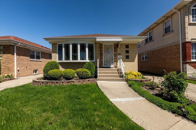 4717 N Newcastle Ave, Harwood Heights, IL 60706 - view of front of home featuring brick siding and a front yard