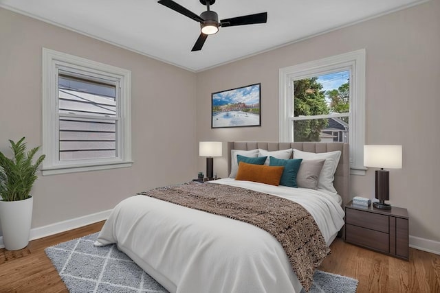 3811 N Pioneer Ave, Chicago, IL 60634 - bedroom featuring baseboards, wood finished floors, and ceiling fan