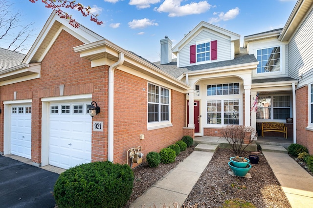 921 Winners Cup Ct, Naperville, IL 60565 - traditional-style house with brick siding, a garage, a chimney, and a shingled roof
