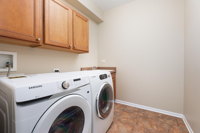 921 Winners Cup Ct, Naperville, IL 60565 - laundry room featuring washing machine and clothes dryer, cabinet space, baseboards, and stone finish floors