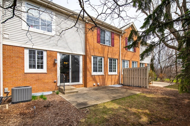 921 Winners Cup Ct, Naperville, IL 60565 - back of property with central AC, a patio area, entry steps, and brick siding