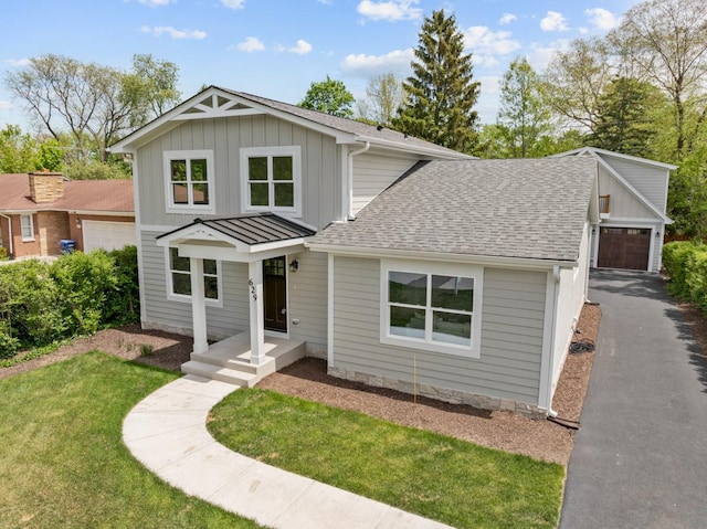 629 N Lincoln Ave, Geneva, IL 60134 - view of front of home featuring a shingled roof, board and batten siding, and a front yard