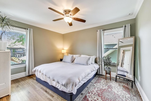 518 Clarence Ave, Oak Park, IL 60304 - bedroom featuring wood finished floors, baseboards, crown molding, and ceiling fan