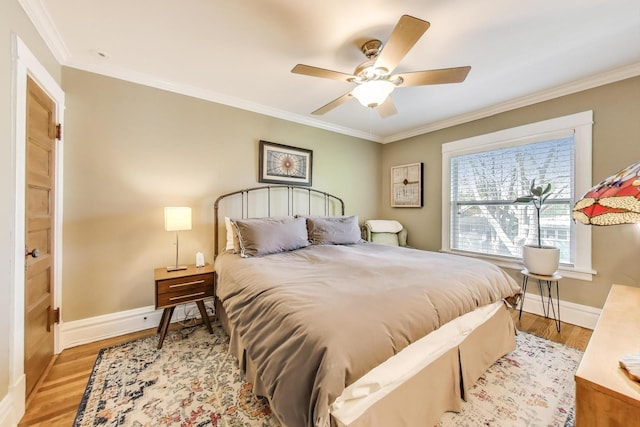 518 Clarence Ave, Oak Park, IL 60304 - bedroom with ornamental molding, baseboards, light wood-style flooring, and a ceiling fan