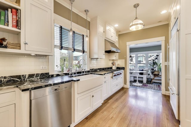 518 Clarence Ave, Oak Park, IL 60304 - kitchen with appliances with stainless steel finishes, ventilation hood, white cabinetry, a sink, and crown molding