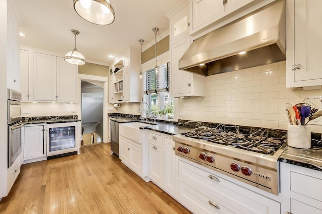 518 Clarence Ave, Oak Park, IL 60304 - kitchen with under cabinet range hood, beverage cooler, a sink, appliances with stainless steel finishes, and white cabinets