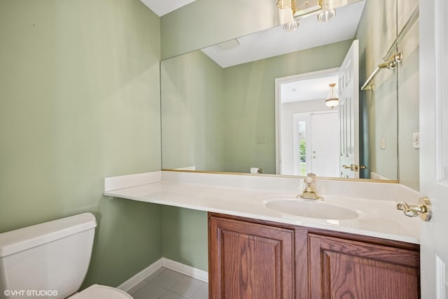 1924 W Ashbury Ln, Inverness, IL 60067 - bathroom featuring tile patterned flooring, toilet, baseboards, and vanity