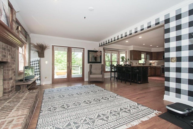5 Piper Ln, Hawthorn Woods, IL 60047 - living room featuring baseboards, wallpapered walls, wood finished floors, ornamental molding, and french doors