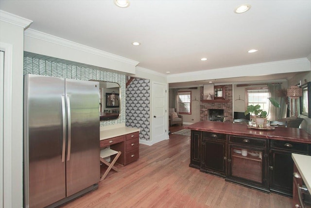 5 Piper Ln, Hawthorn Woods, IL 60047 - kitchen featuring freestanding refrigerator, ornamental molding, open floor plan, a fireplace, and light wood finished floors
