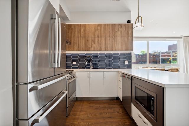 3101 N Ridgeway Ave Unit 2C, Chicago, IL 60618 - kitchen featuring appliances with stainless steel finishes, light countertops, backsplash, and white cabinetry