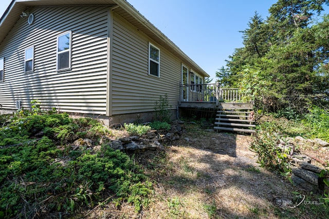 5567 N Mill Creek Rd, Scales Mound, IL 61075 - view of home's exterior with a wooden deck and stairs