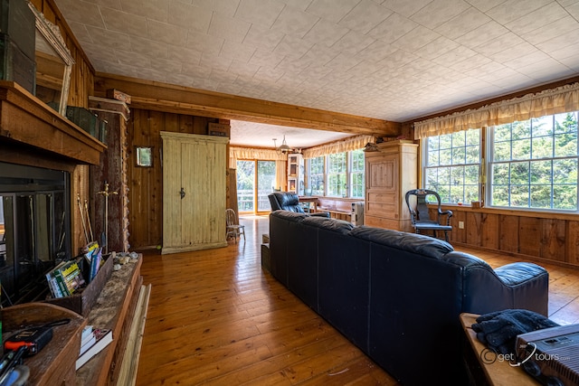 5567 N Mill Creek Rd, Scales Mound, IL 61075 - living room with wooden walls, wood-type flooring, and beamed ceiling