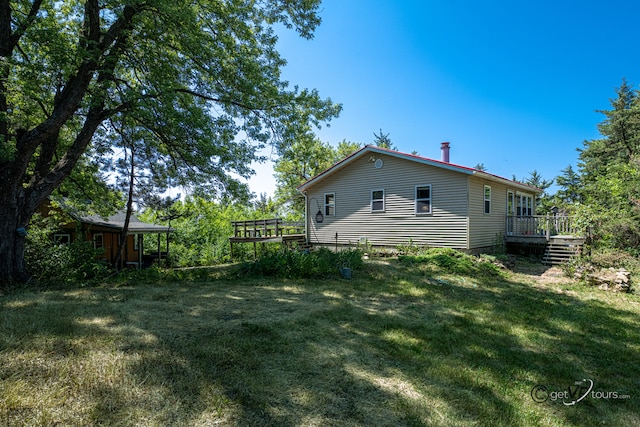 5567 N Mill Creek Rd, Scales Mound, IL 61075 - view of grassy yard with a deck