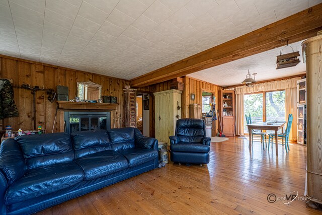 5567 N Mill Creek Rd, Scales Mound, IL 61075 - living room with wooden walls and hardwood / wood-style floors