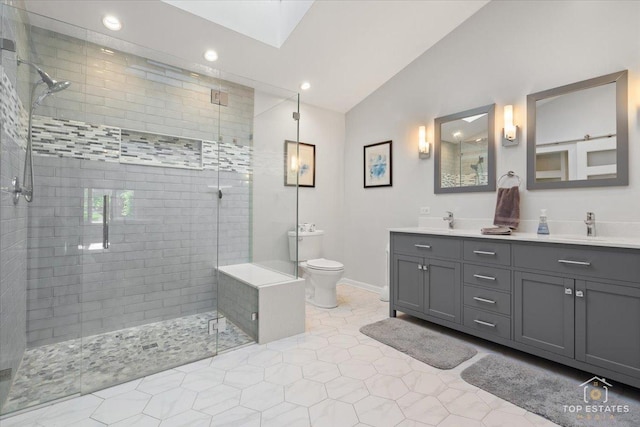 203 Royal Ct, Prospect Heights, IL 60070 - bathroom featuring lofted ceiling, a tile shower, tile patterned floors, toilet, and double vanity