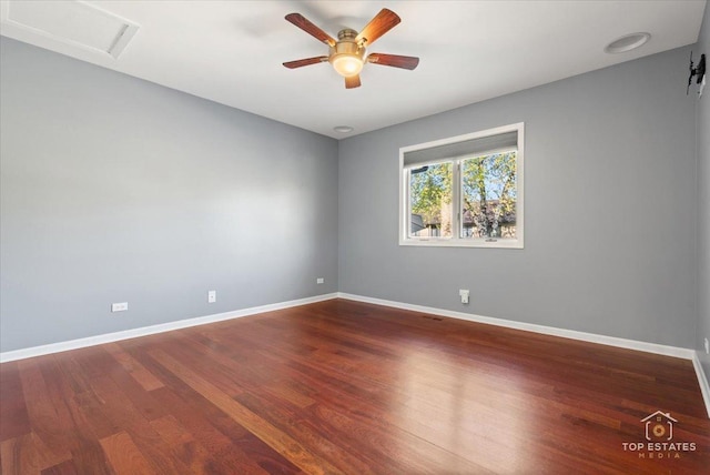 203 Royal Ct, Prospect Heights, IL 60070 - unfurnished room with wood finished floors, ceiling fan, baseboards, and attic access