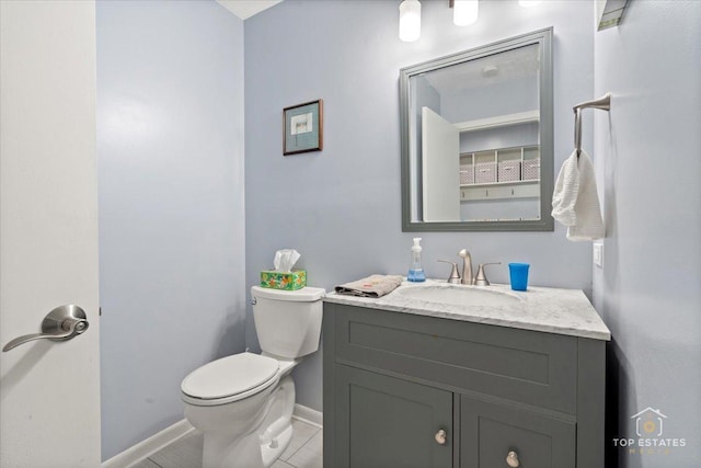 203 Royal Ct, Prospect Heights, IL 60070 - half bath with toilet, baseboards, tile patterned flooring, and vanity