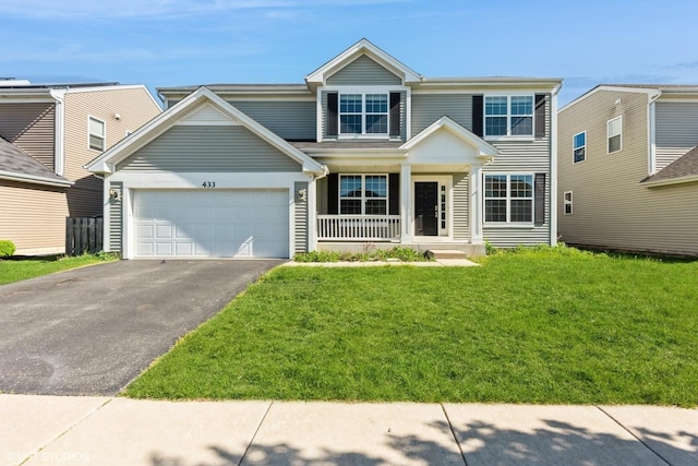 433 Minuet Cir, Volo, IL 60073 - view of front of property with driveway, covered porch, a garage, and a front lawn