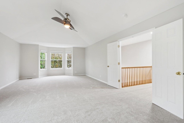 2913 Glenarye Dr, Lindenhurst, IL 60046 - empty room featuring ceiling fan, vaulted ceiling, carpet, and baseboards