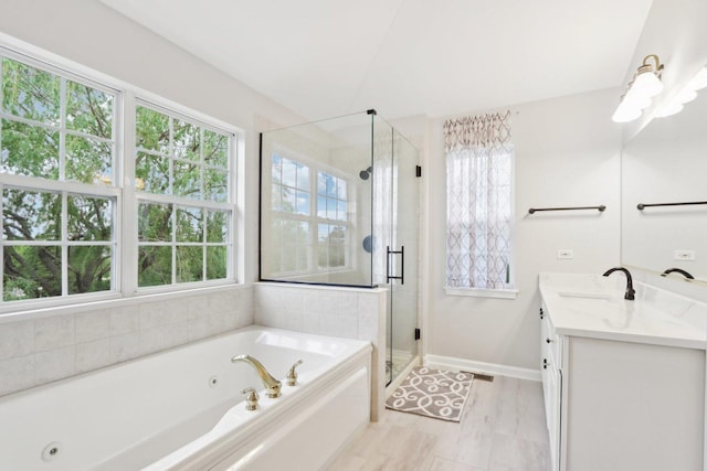 2913 Glenarye Dr, Lindenhurst, IL 60046 - bathroom with vanity, a whirlpool tub, a stall shower, and baseboards