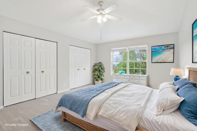 2913 Glenarye Dr, Lindenhurst, IL 60046 - bedroom featuring multiple closets, light wood-style flooring, a ceiling fan, and baseboards