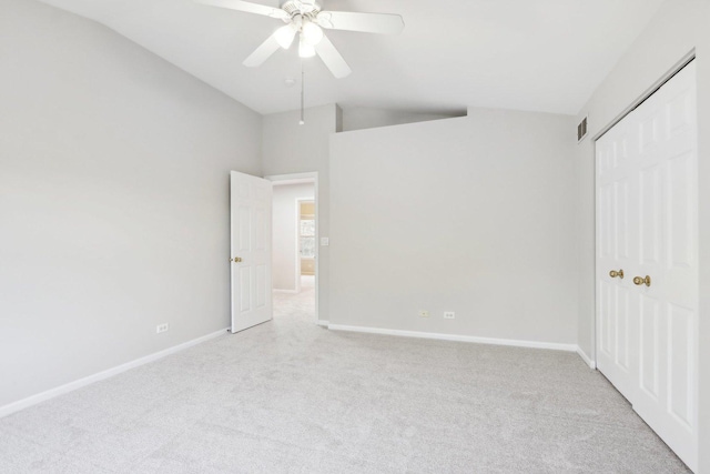 2913 Glenarye Dr, Lindenhurst, IL 60046 - unfurnished bedroom with vaulted ceiling, light carpet, baseboards, a closet, and a ceiling fan