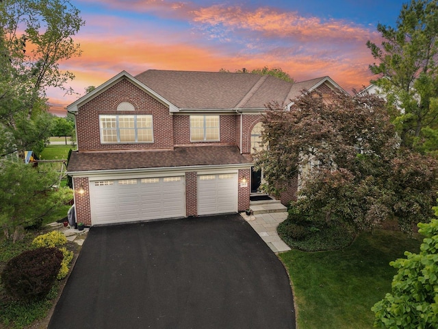 2913 Glenarye Dr, Lindenhurst, IL 60046 - traditional home with a garage, driveway, brick siding, a shingled roof, and a front yard