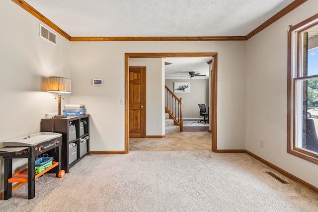 2610 Worthington Dr, Champaign, IL 61822 - interior space with crown molding, light colored carpet, a textured ceiling, baseboards, and ceiling fan