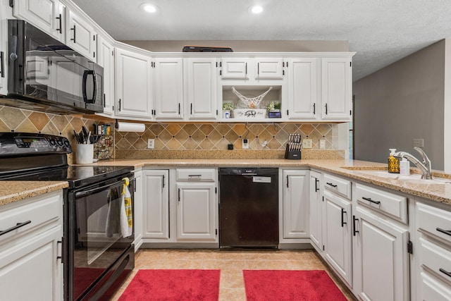 2610 Worthington Dr, Champaign, IL 61822 - kitchen featuring black appliances, a sink, white cabinets, tasteful backsplash, and recessed lighting