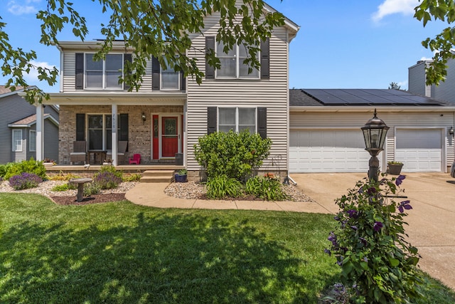 2610 Worthington Dr, Champaign, IL 61822 - traditional-style house featuring covered porch, driveway, an attached garage, and a front lawn
