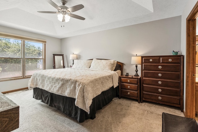 2610 Worthington Dr, Champaign, IL 61822 - bedroom with light colored carpet, a tray ceiling, ceiling fan, and baseboards