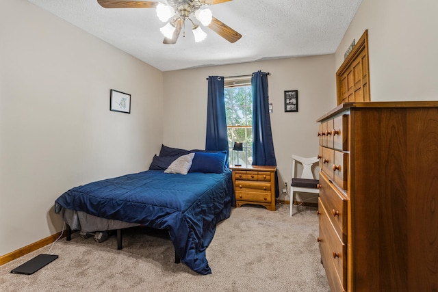 2610 Worthington Dr, Champaign, IL 61822 - bedroom featuring light carpet, baseboards, a ceiling fan, and a textured ceiling
