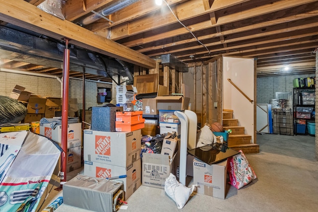 2610 Worthington Dr, Champaign, IL 61822 - unfinished below grade area featuring stairway and brick wall