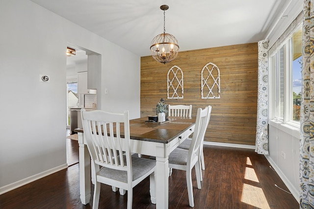 17719 Oakwood Dr, Tinley Park, IL 60487 - dining space featuring wooden walls, a chandelier, baseboards, an accent wall, and healthy amount of natural light