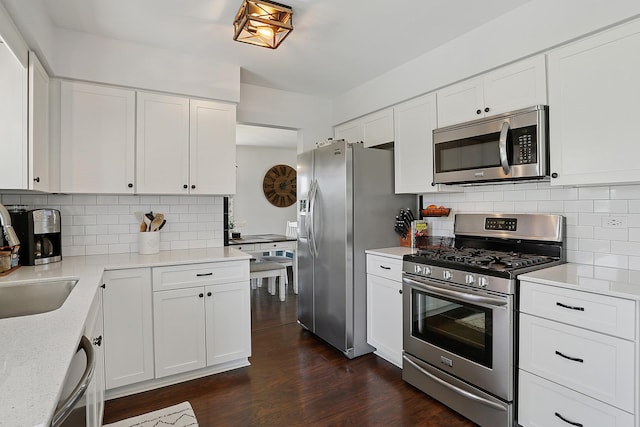 17719 Oakwood Dr, Tinley Park, IL 60487 - kitchen featuring stainless steel appliances, backsplash, and white cabinets