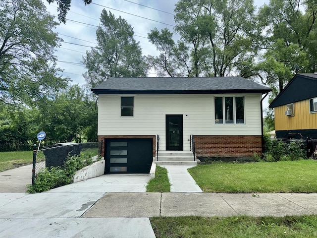 13235 S Vernon Ave, Chicago, IL 60827 - split foyer home with brick siding, driveway, a garage, and roof with shingles