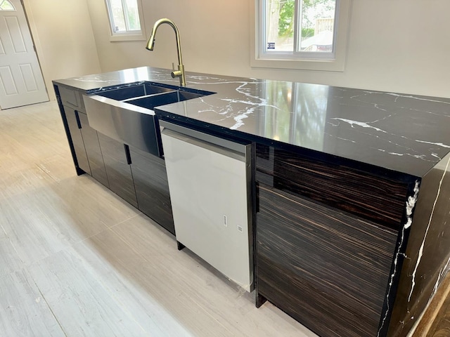 13235 S Vernon Ave, Chicago, IL 60827 - kitchen featuring dishwasher, a kitchen island with sink, modern cabinets, light wood-type flooring, and dark countertops