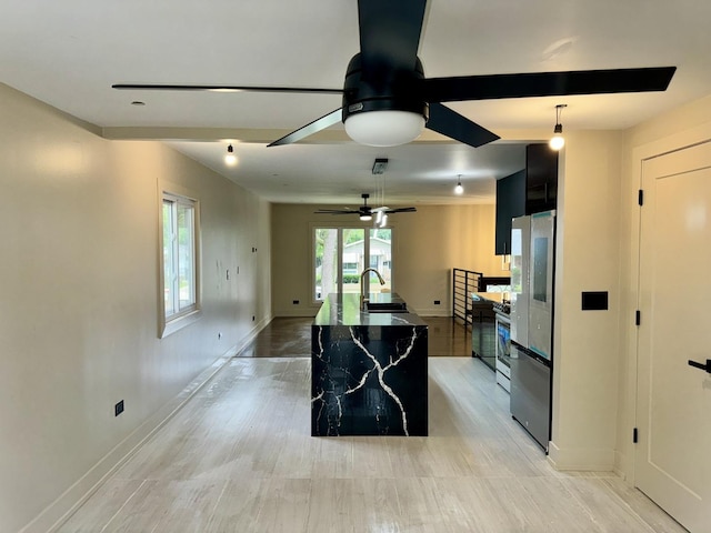 13235 S Vernon Ave, Chicago, IL 60827 - kitchen featuring a ceiling fan, smart refrigerator, a kitchen island with sink, and dark cabinetry