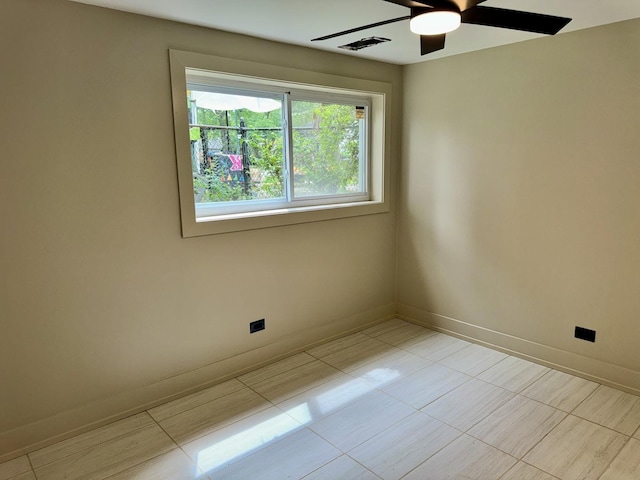13235 S Vernon Ave, Chicago, IL 60827 - spare room with a ceiling fan and light tile patterned floors