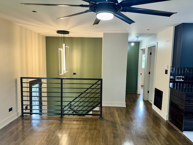 13235 S Vernon Ave, Chicago, IL 60827 - empty room with wood finished floors and a ceiling fan