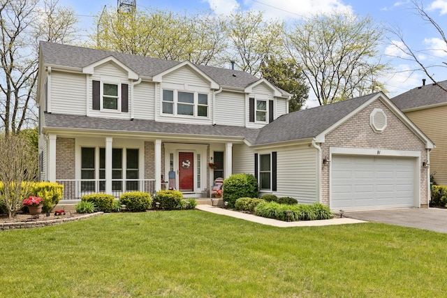 91 Southfield Dr, Vernon Hills, IL 60061 - traditional-style house featuring brick siding, driveway, an attached garage, a front lawn, and roof with shingles