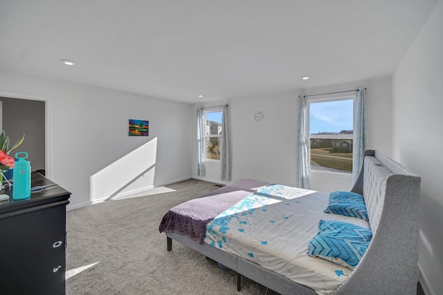 bedroom featuring multiple windows, carpet flooring, recessed lighting, and baseboards