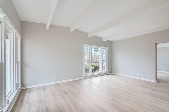 empty room featuring baseboards and light wood-style floors