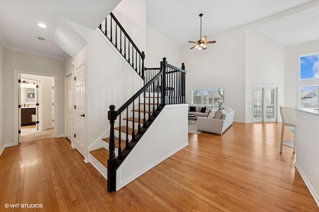 21827 W Riviera Ct, Ivanhoe, IL 60060 - stairway with ceiling fan, plenty of natural light, wood finished floors, baseboards, and a high ceiling