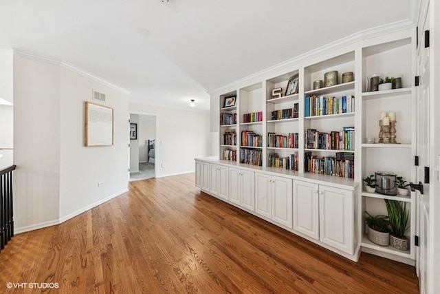 21827 W Riviera Ct, Ivanhoe, IL 60060 - sitting room featuring wood finished floors, baseboards, and crown molding