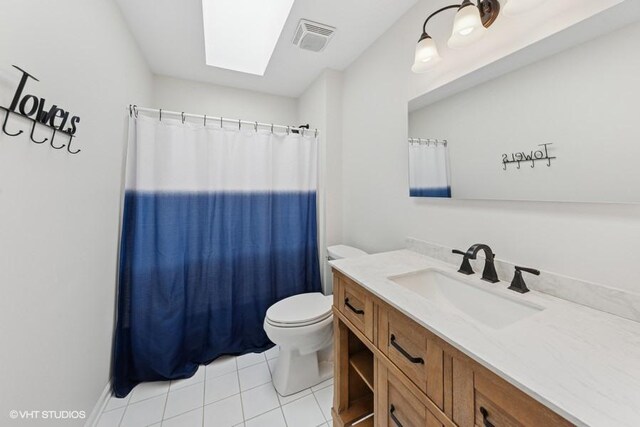 21827 W Riviera Ct, Ivanhoe, IL 60060 - full bath featuring toilet, tile patterned floors, vanity, a shower with shower curtain, and a skylight