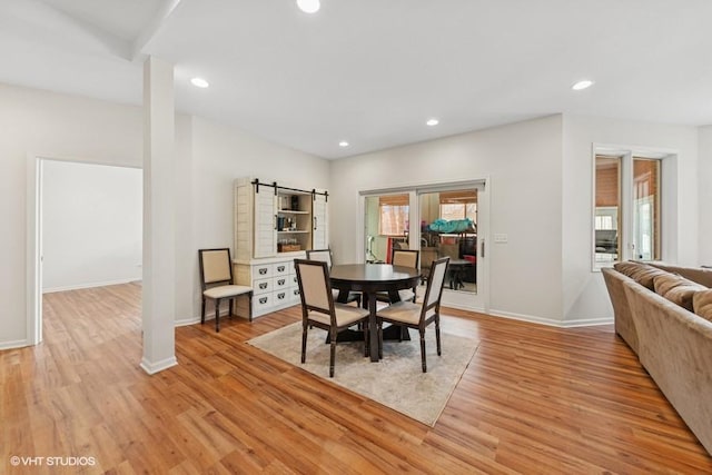 21827 W Riviera Ct, Ivanhoe, IL 60060 - dining room featuring light wood-style flooring, recessed lighting, baseboards, and a barn door