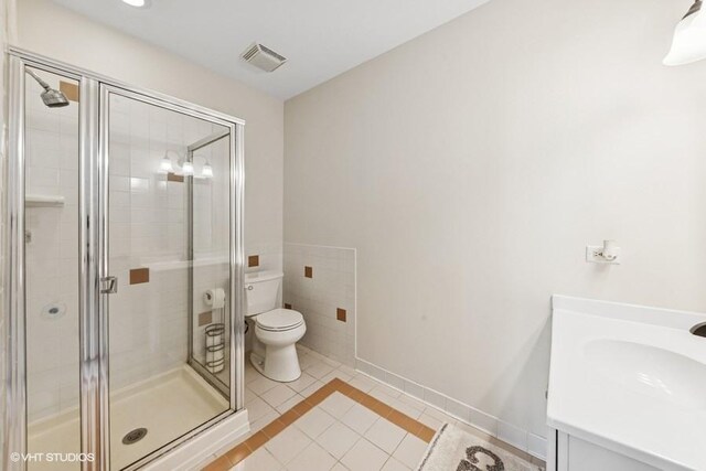 21827 W Riviera Ct, Ivanhoe, IL 60060 - full bath featuring tile patterned flooring, a shower stall, toilet, vanity, and baseboards